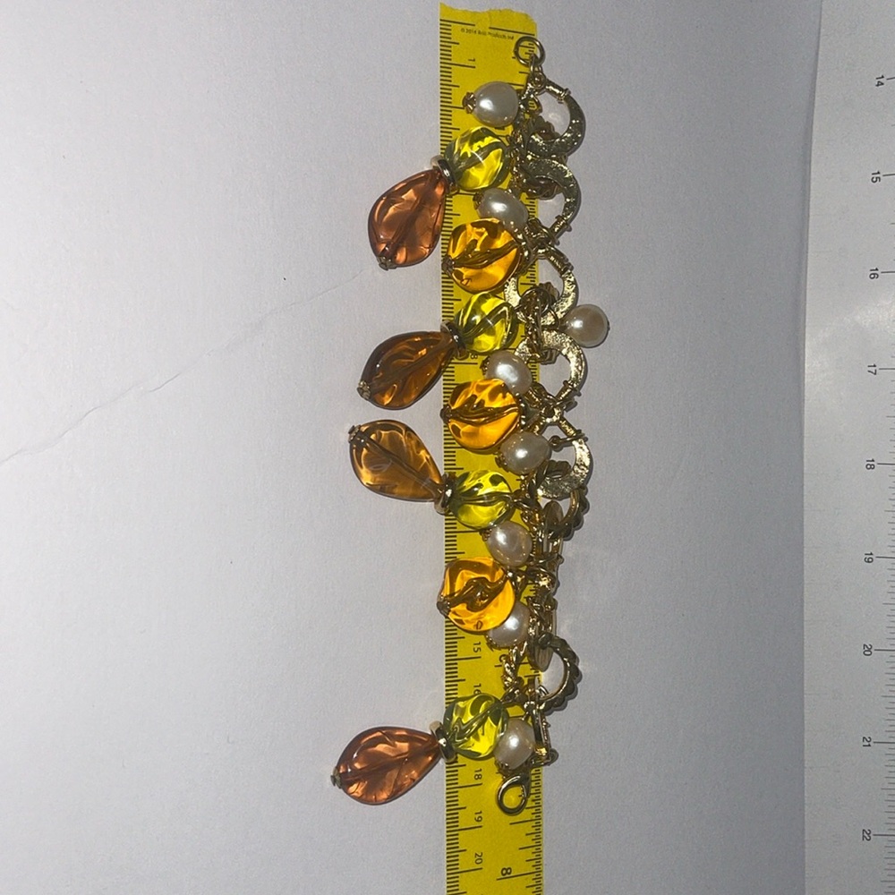Beautiful gold tone bracelet. Fall colors
